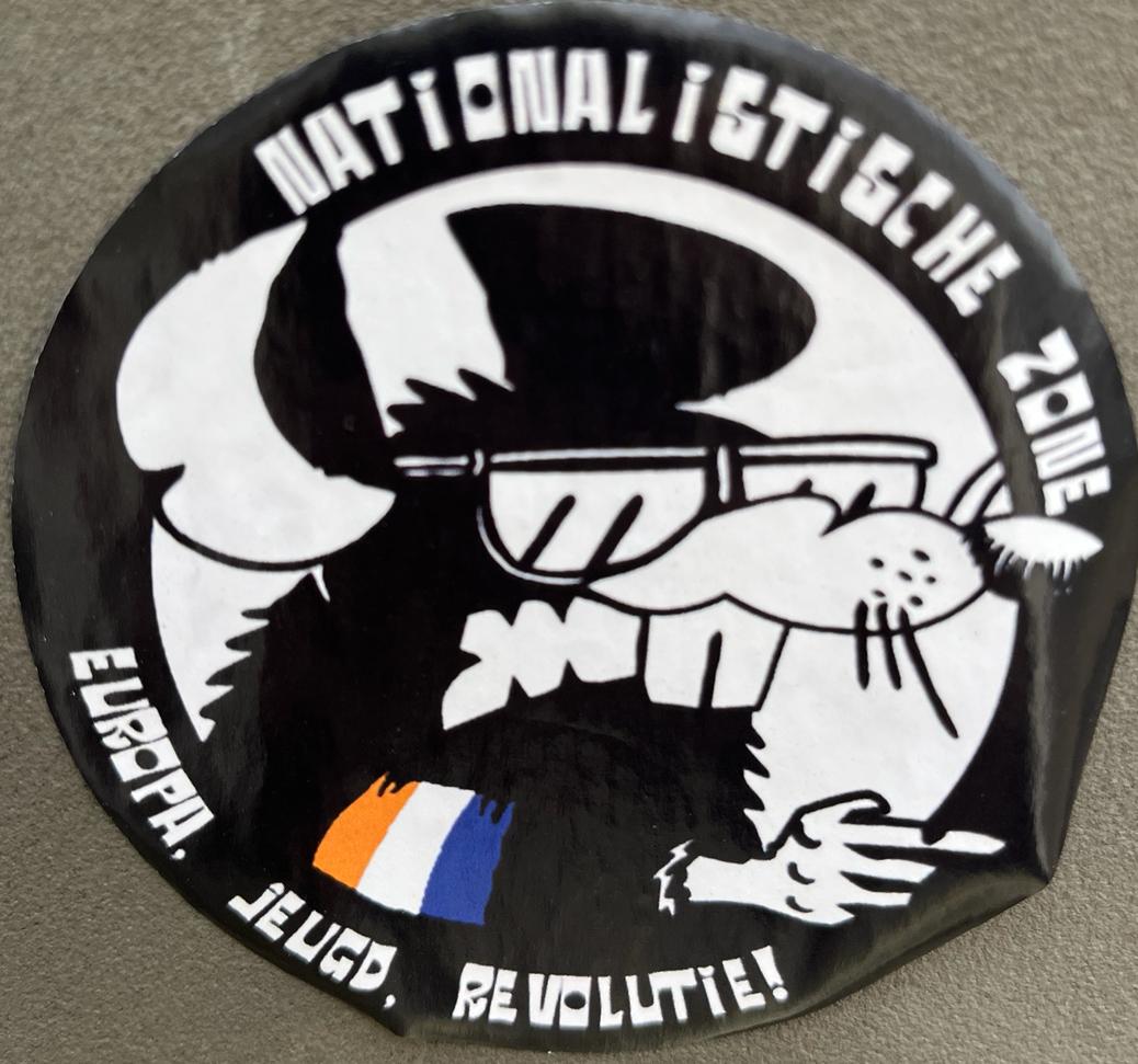 A circular sticker with a cartoon animal. It reads "Nationalistische zone" and "Europa Jeugd Revolutie"